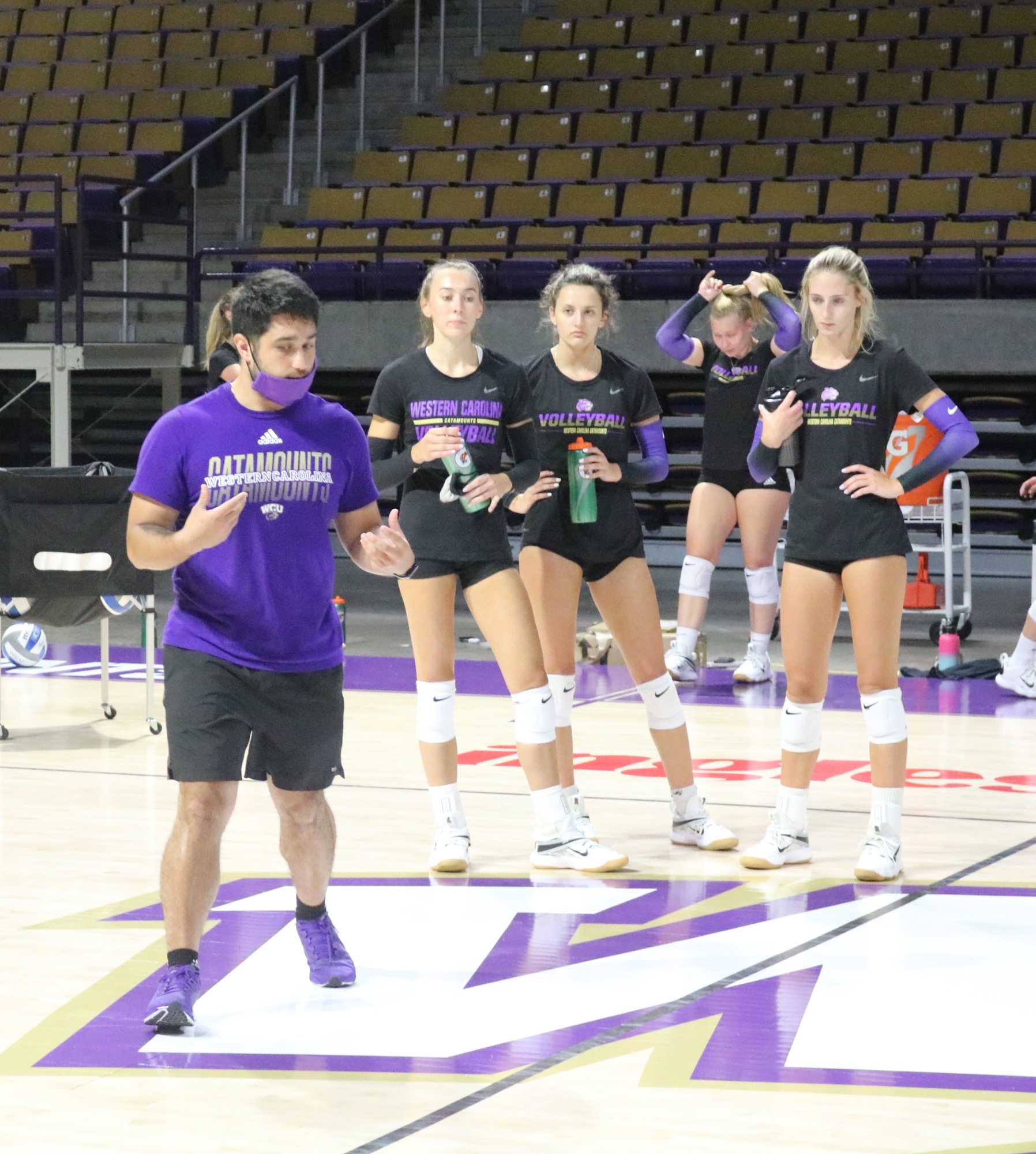 Atlas coach instructing players on the court